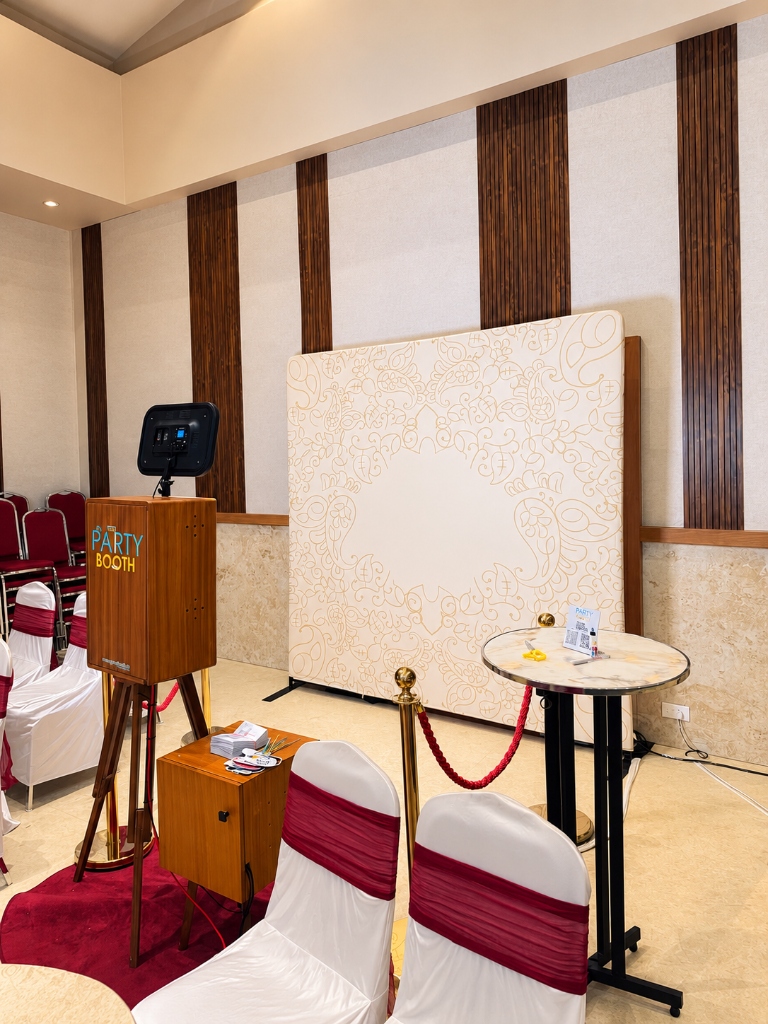 Complete Retro Vintage Photobooth setup with elegant backdrop and guest wish book table at Kenz Convention Centre, Muvattupuzha